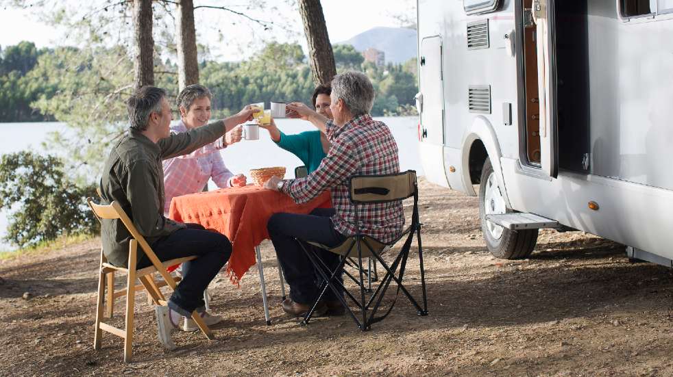 Join a Boundless group two couples having drink motorhome